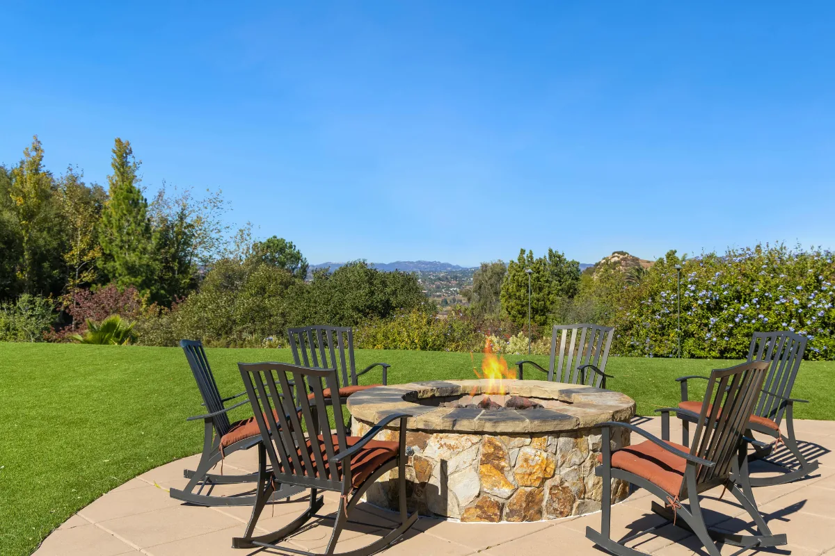 Concrete patio with stone fire pit and seating near Baldwin NY — Nassau County Concrete