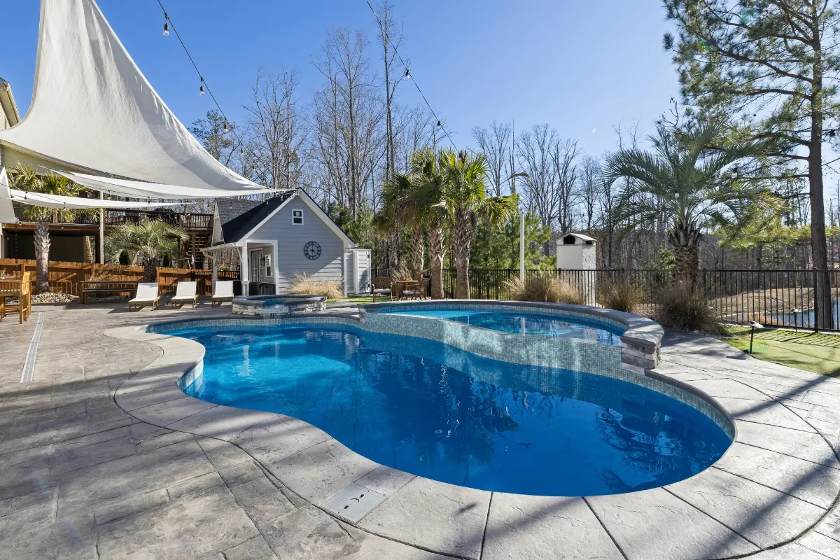 Stamped concrete pool deck around freeform pool near Baldwin NY — Nassau County Concrete